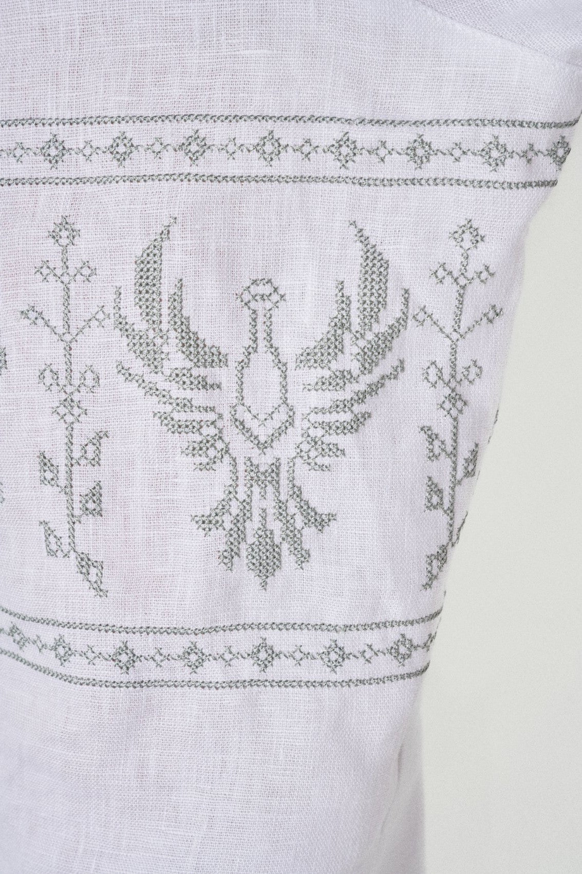 The phoenix she chose, cross-stitched on the sleeve of the vyshyvanka