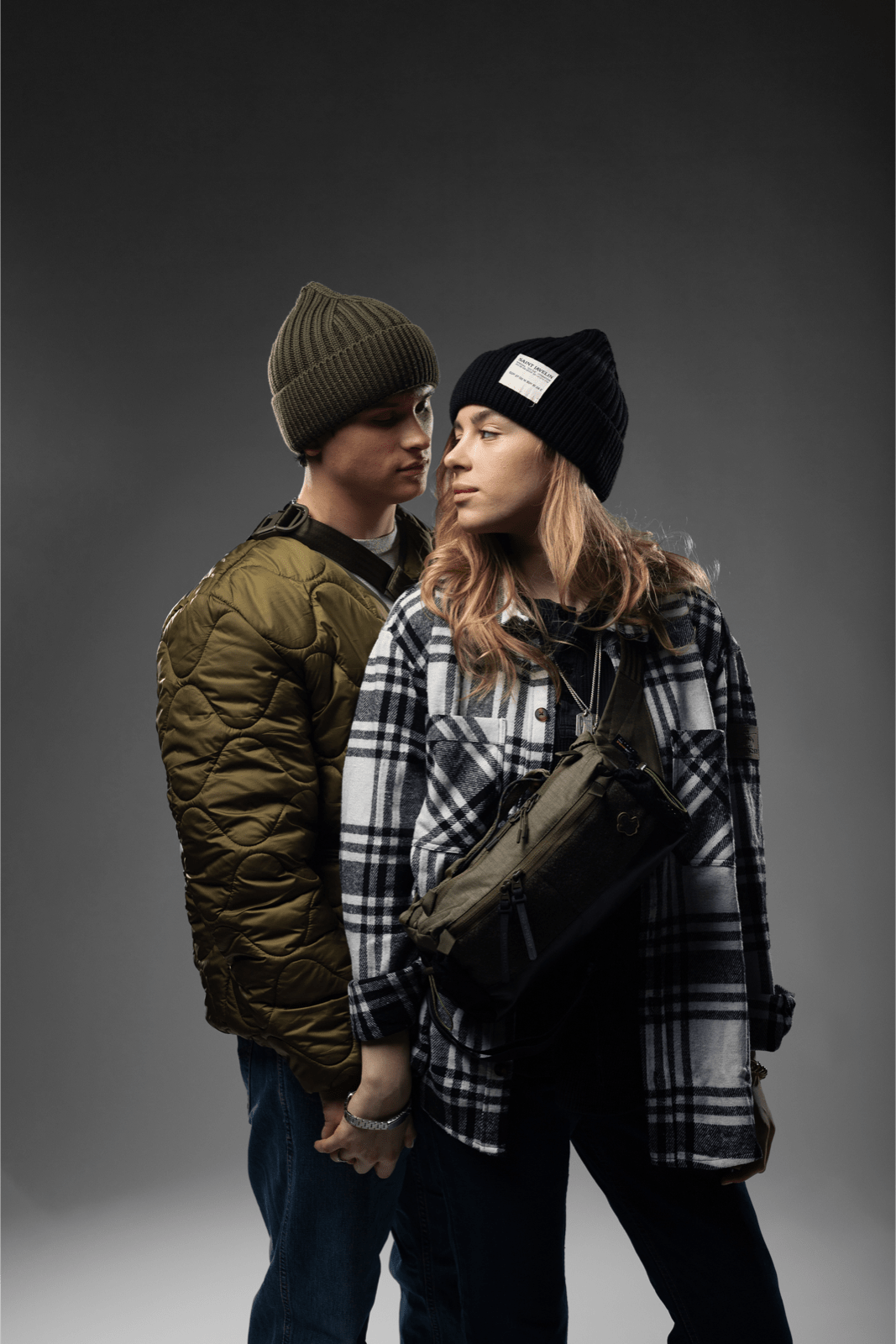 Two people outdoors with an Arakawa slingpack