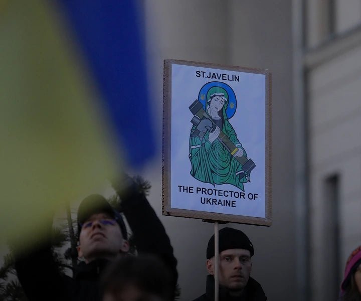 A supporter holding a Saint Javelin sign