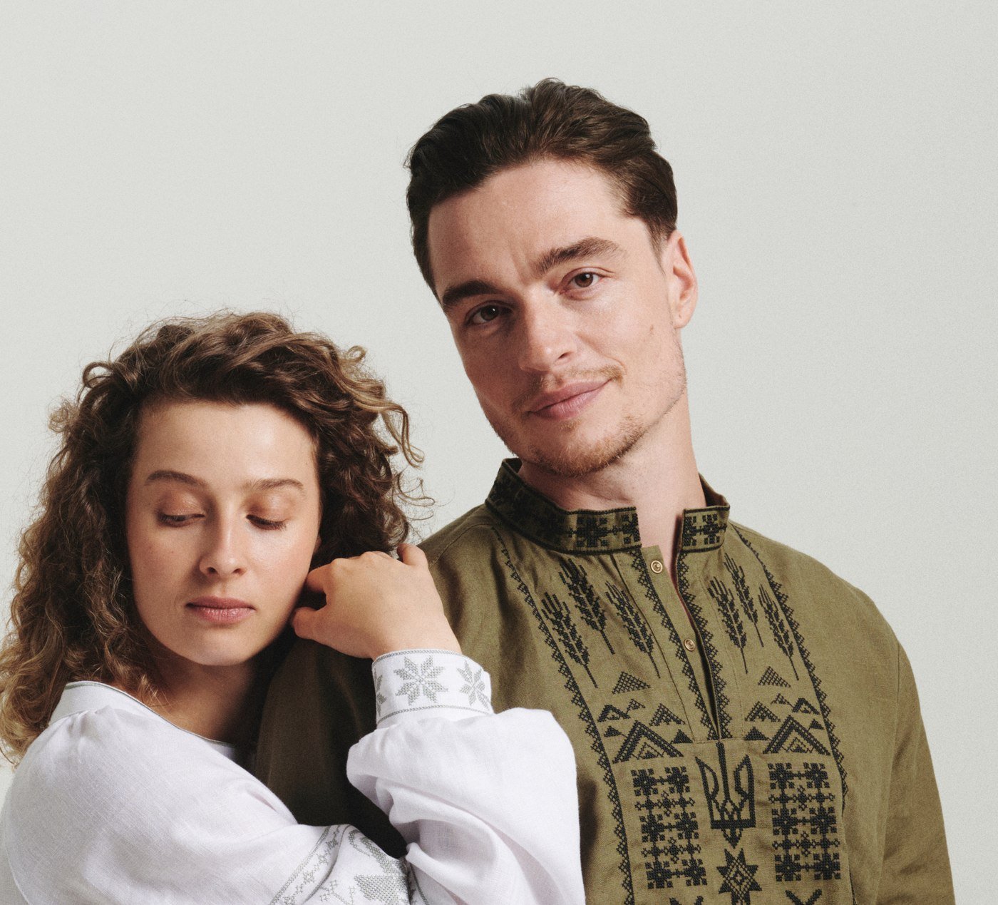 Couple wearing Saint Javelin vyshyvankas, the men's embroidered linen shirt and the first women's vyshyvanka
