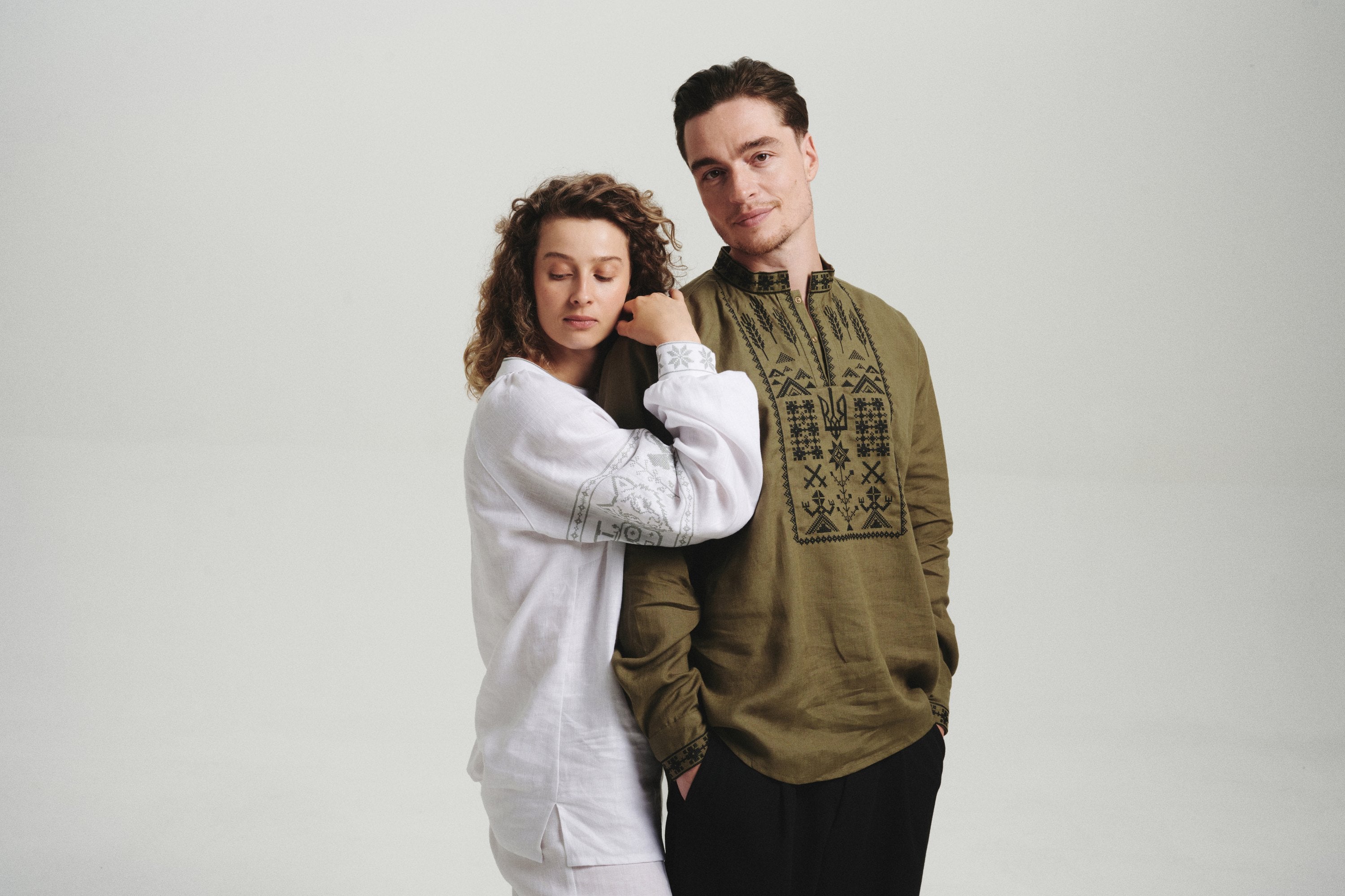 Couple wearing Saint Javelin vyshyvankas, the men's embroidered linen shirt and the first women's vyshyvanka